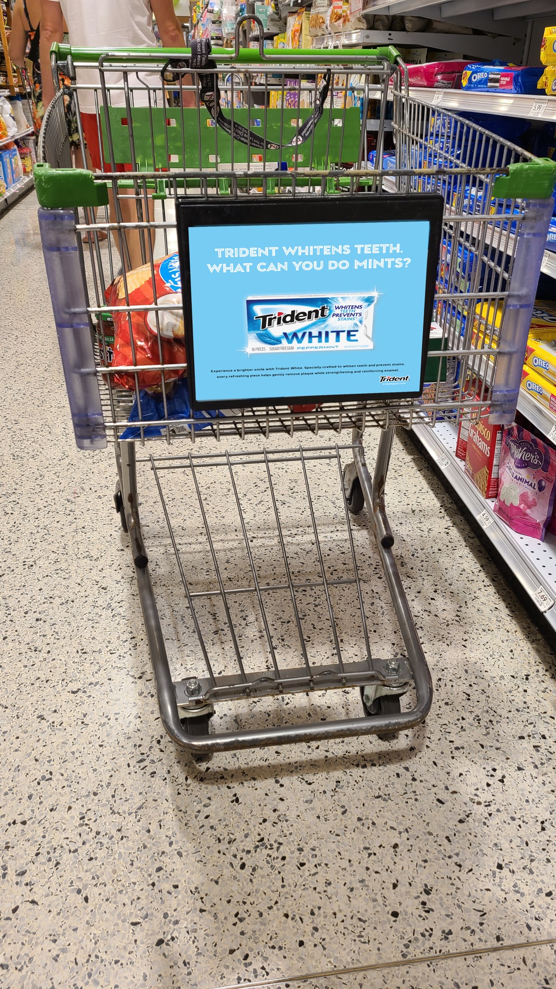 Shopping cart with ad for Crest 3D White toothpaste